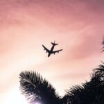 airplane under cloudy sky during daytime